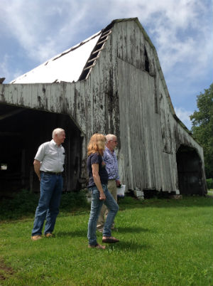 Group walks outside barn